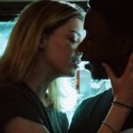 woman about to kiss man